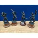 A set of 4 Asian bronze musician players sat up on wooden plinths