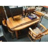 A farmhouse style Pine table and 3 chairs