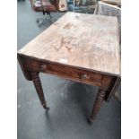 A 19th century penbrooke table with fitted drawer