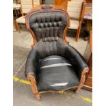 A 19th century button back carved armchair (in need of attention)