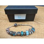 925 Silver Chamilia charm bracelet and charms. 12 charms in total.