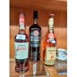 A Collection of 3 bottles to include Black parrot rum, Bacardi along with Majestat Weinbrand rum