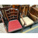 An antique arm chair along with ladder back chair
