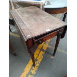 A 19th century penbrooke table with fitted drawer
