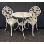 White painted cast metal garden table with two matching chairs