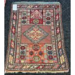 Middle Eastern hand woven rug, red ground [121x91cm]