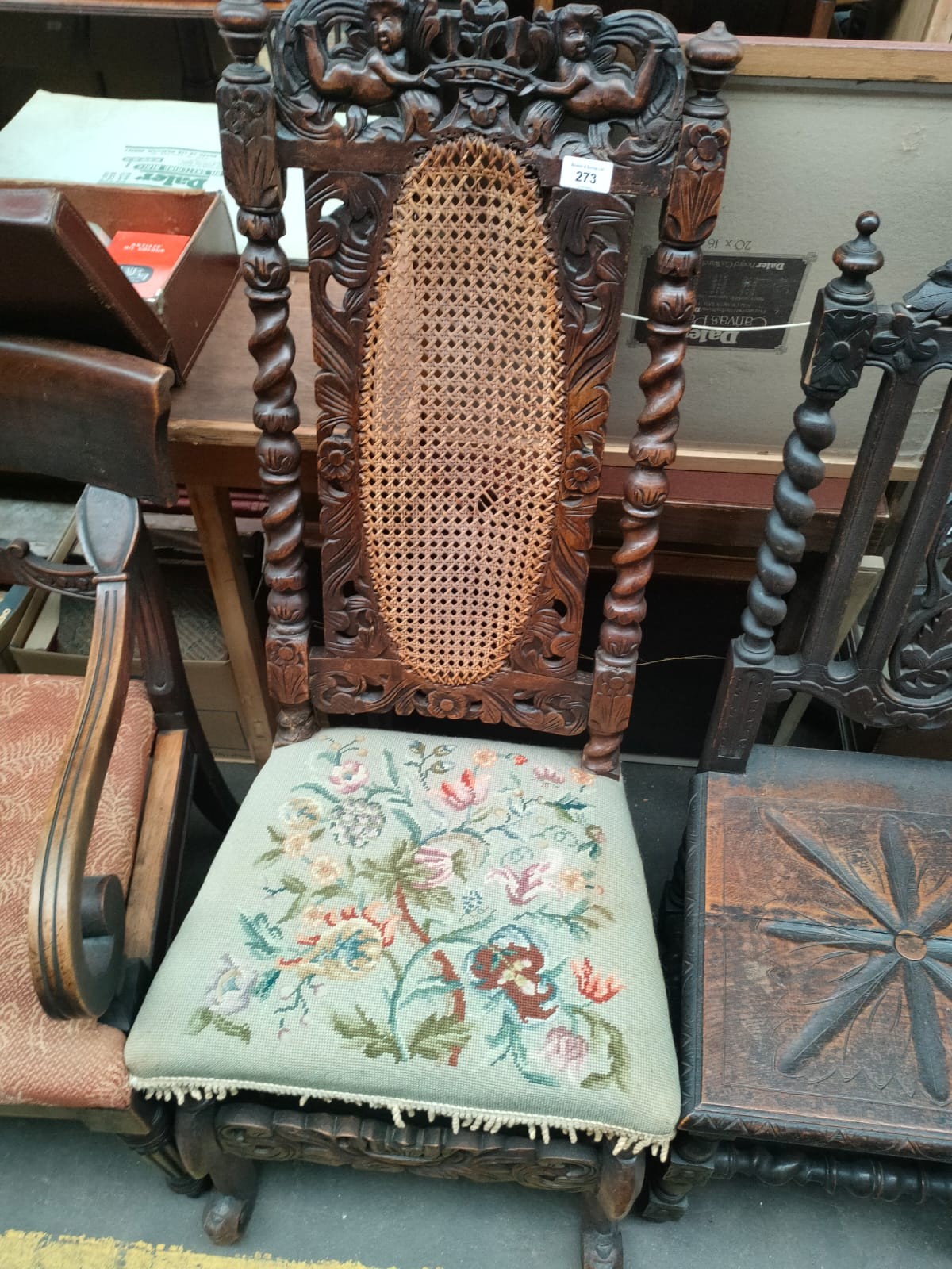 A 19th century Highly carved back chair with cherub foliage