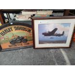A Lancaster bomber print along with Harley Davidson design motorcycle plaque