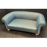 Victorian two seat Chesterfield settee, upholstered in a blue patterned silk material, raised on