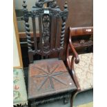 A 19th century Carved high back chair