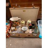Vintage Globe Trotter suitcase and contents; Indian figure sat upon and elephant small planter,