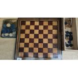 Antique chess board and checkers.