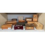 Shelf of various trinket boxes; puzzle boxes and jewel boxes.