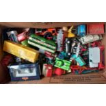 A Box of play worn toy cars, planes, tanks and some boxed toys.