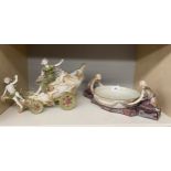 Two Art Deco inspired porcelain figurines; Lady wearing robes and cherub on chariot bowl &