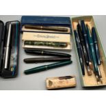 A Collection of vintage fountain pens; Four fountain pens fitted with 14ct gold nibs. Watermans