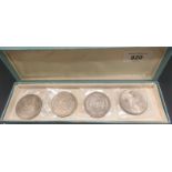 Four various silver American one dollar coins; 1879, 1885, 1883 & 1924.
