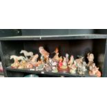 A Shelf of collectable animal figures; Mostly Border Fine Arts