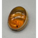 Birmingham 9ct yellow gold and amber brooch. Catch and pin work well. [3x2.5cm] [6.93grams]