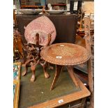 Indian barrel top table with folding base and African Carved folding table base and weaved hand fan.