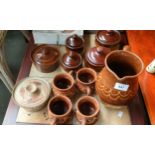 Studio pottery water jug and cups & soup pots with lids.