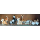 A Shelf of USSR Animal figurines; Giraffe, Lion cubs, Fox, Badger and rabbits.