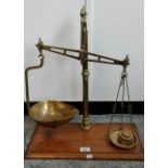 Antique Mahogany and brass weighing scales with weights.