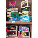 Two shelves of boxed car models to include vanguards and corgi.