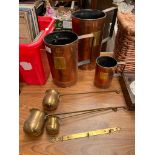 Three large copper and brass measuring jugs, Together with three Brass measures with copper labels