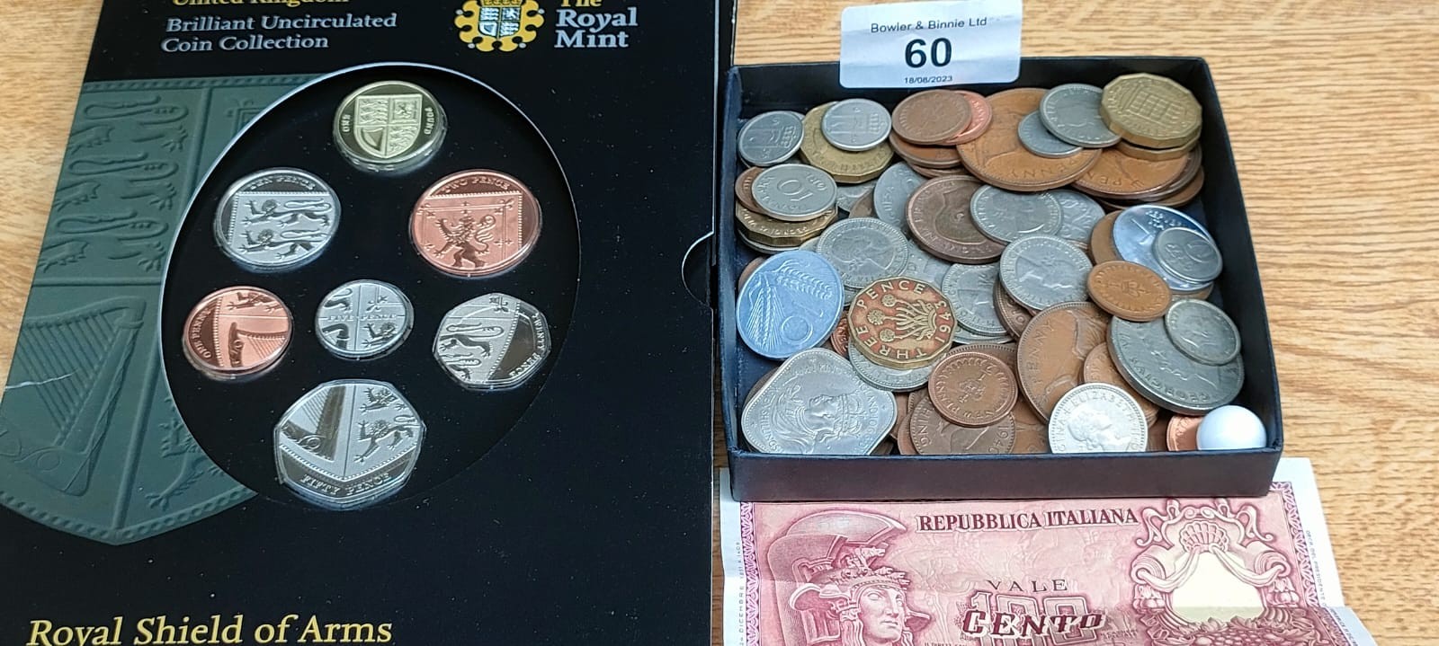 A Box of mixed world coins. Includes 1937 silver three pence and the Royal Mint United Kingdom