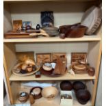 Three shelves of treen wares; Turned wooden bowls, marquetry pictures, teak Ronson lighter, Door