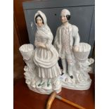 A Pair of Victorian Staffordshire figures- fisherman and wife.