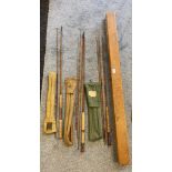 Three vintage fly rods and bags together with a wooden carry case; Hardy brothers two piece fly