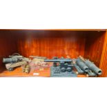 Shelf of various canon models- metal and brass models
