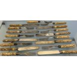 Antique Asian themed bone carved handled forks and knives.