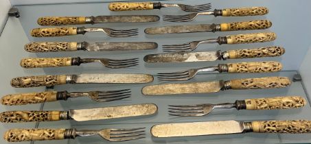 Antique Asian themed bone carved handled forks and knives.