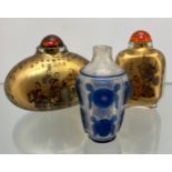 Three various Chinese perfume/ snuff bottles, One with blue raised relief cut section designs.