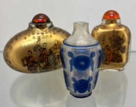 Three various Chinese perfume/ snuff bottles, One with blue raised relief cut section designs.