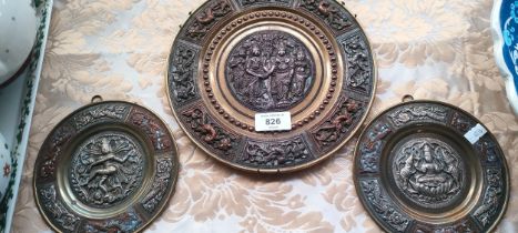 Three Far Eastern, silver, copper and brass worked decorative plates.