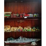 Three shelves of models; Advertising truck models, Gold tone car models, Thomas the tank pewter