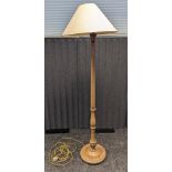 Antique free standing lamp, raised on a circular base ending in bun feet [152cm]