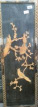 A Chinese lacquered and raised relief bird design wall plaque