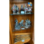Three shelves of collectable lead and pewter figurines.