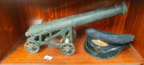 Heavy cast iron canon and stand with military cap