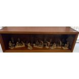 Wood and glass display case containing a collection of Nigerian Life Wooden carved miniature figures