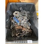 Box containing a large quantity of mixed vintage car badges; Ford, Civic, Nissan, Renault and Suzuki