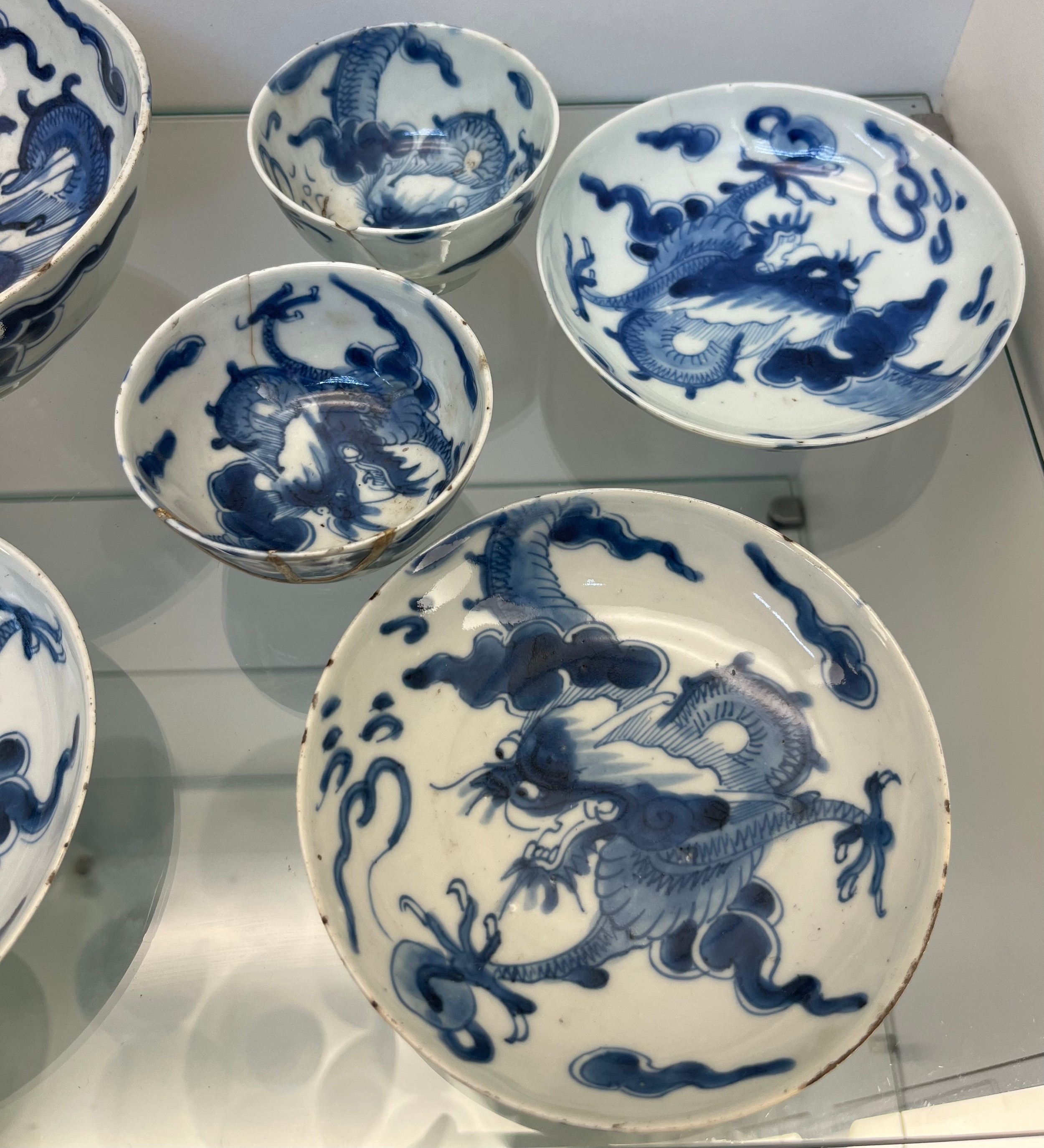 Selection of Antique Chinese blue and white dragon design cups and saucers, matching bowl, one other - Image 2 of 7