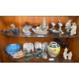 Two shelves of oriental collectables; Mud men figures, Junk boat models, Bronze figure on horse as