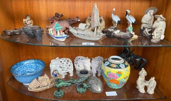 Two shelves of oriental collectables; Mud men figures, Junk boat models, Bronze figure on horse as