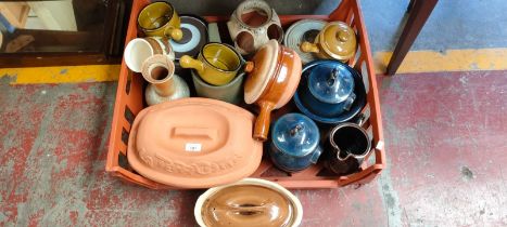 Crate of studio pottery; Terracotta cooking pot, Blue glaze lidded preserve pots and various other